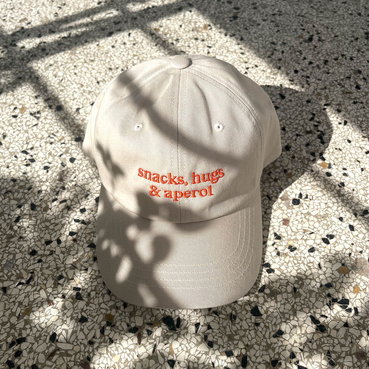 snacks, hugs & aperol Cap – studio ciao